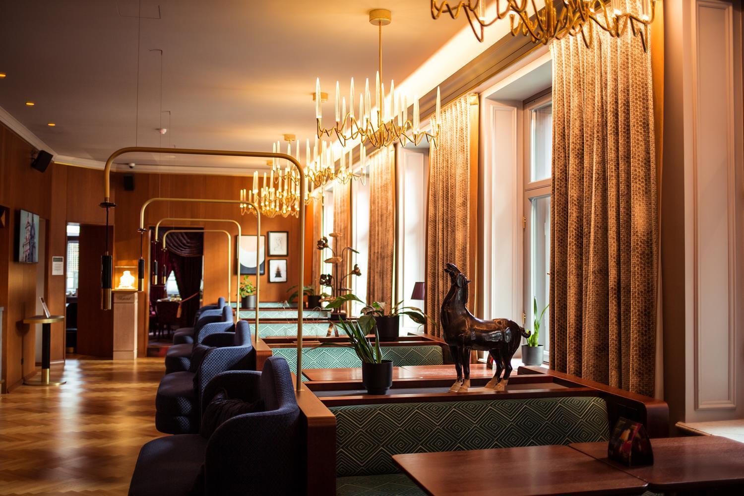 Grand Poet Hotel And Spa By Semarah Riga Exterior foto The interior of the hotel